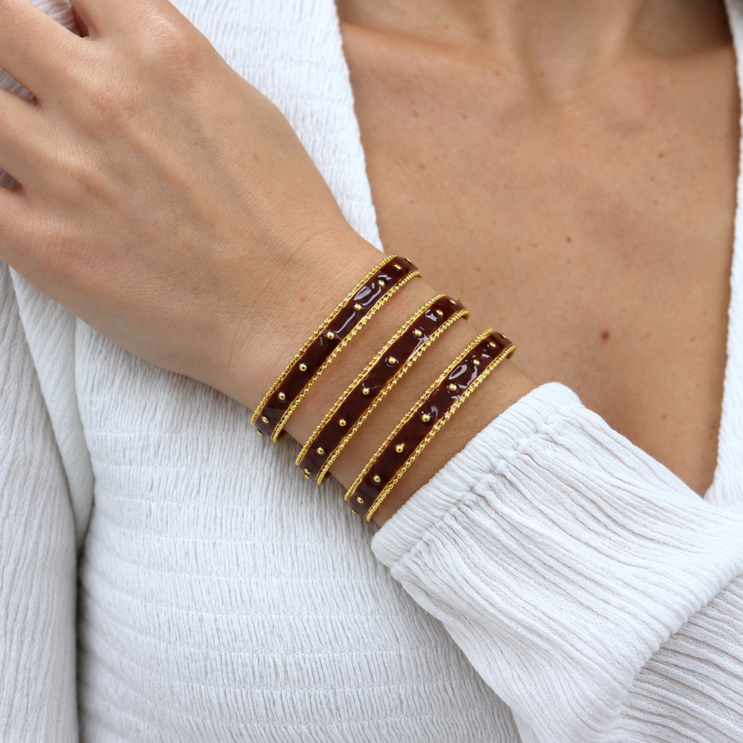 Brown enamel and gold dots three row cuff bracelet worn on model