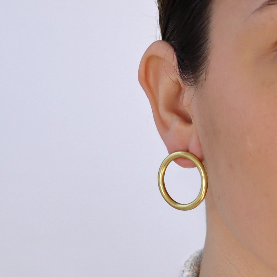 Large polished circle stud earrings
