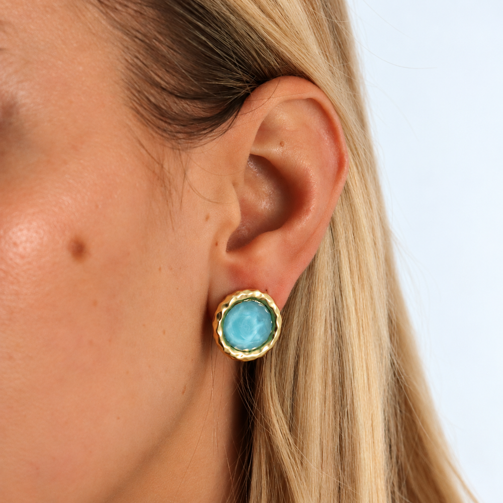 Iridescent Aquamarine Bezel Round Clip-On Earring worn showing sculpted gold plated setting
