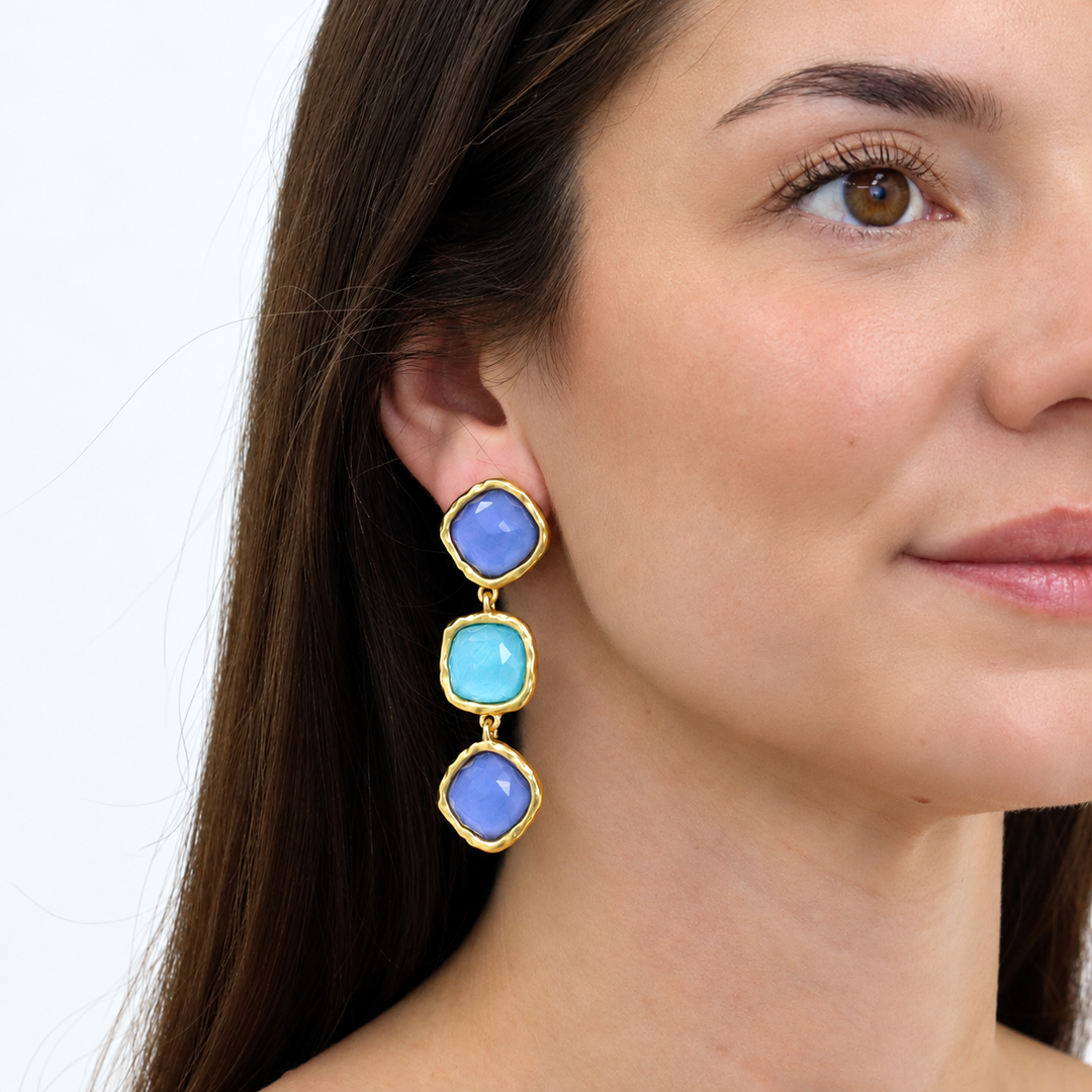 Soft Denim Blue Bezel Trio Clip-On Earrings worn close up showing blue glass drops