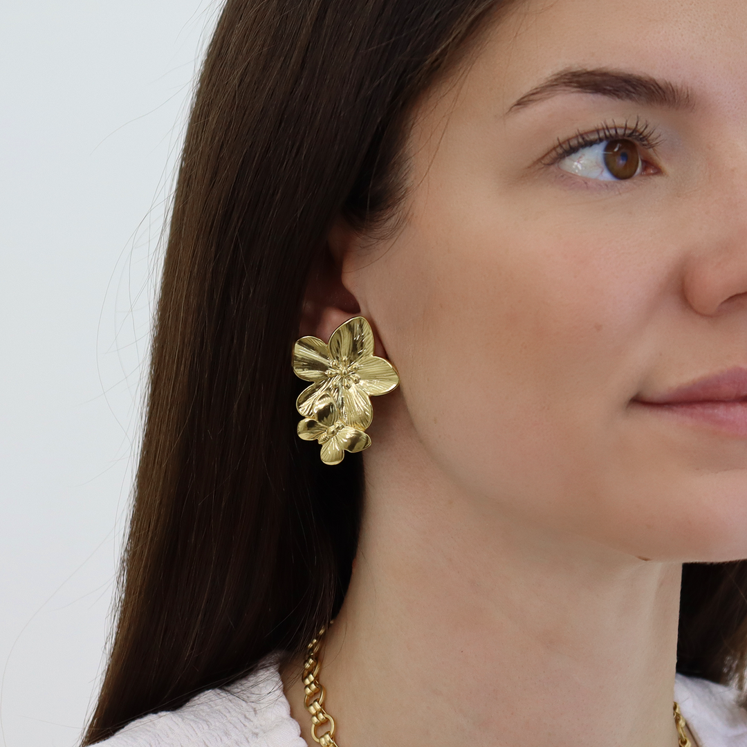 Bloom Clip-On Earrings worn showing textured sculpted flowers