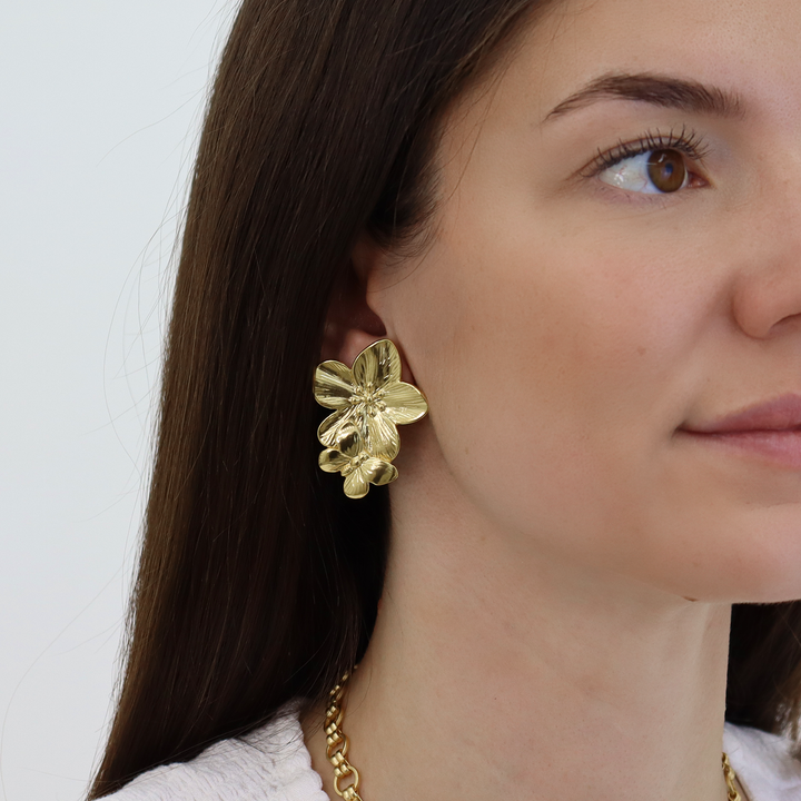 Bloom Clip-On Earrings worn showing textured sculpted flowers