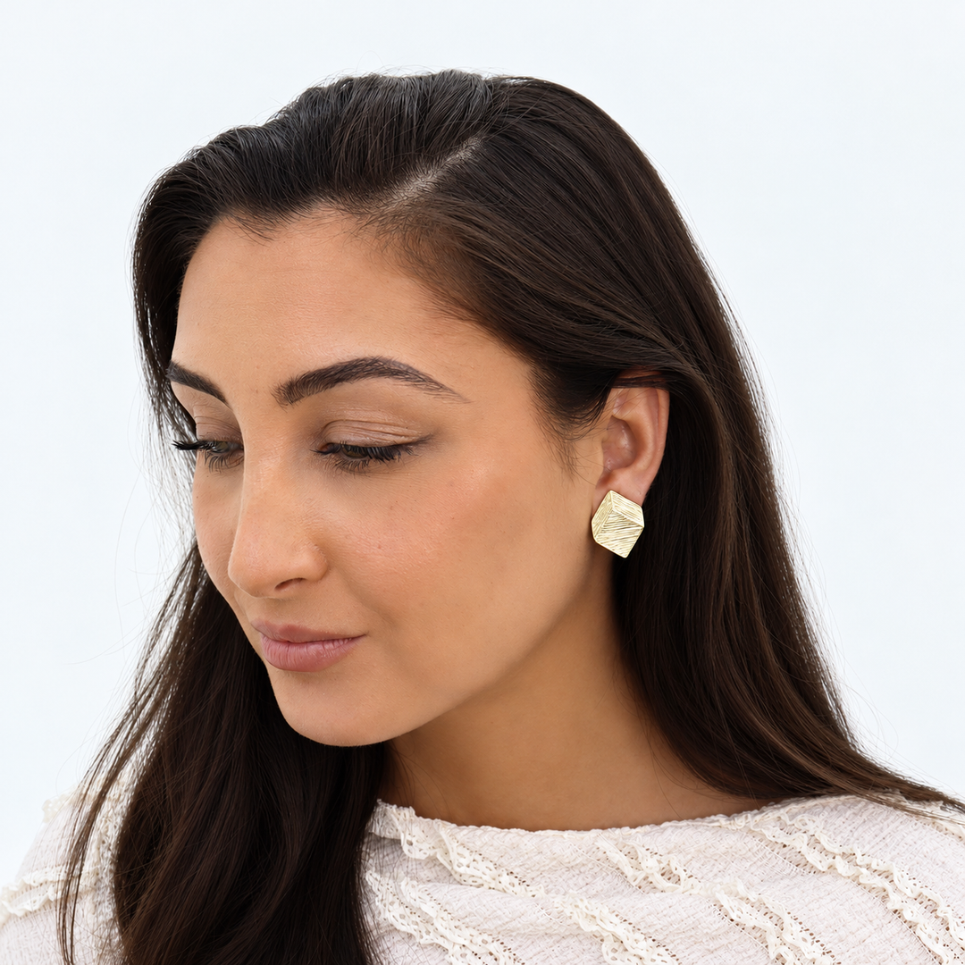 Gold Brushed Square Clip-On Earring worn on brunette model showing angular geometric texture