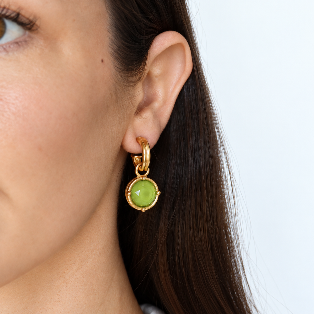 Apple Green Cabochon Charm Hoop Earrings worn showing dangling bright green glass charms