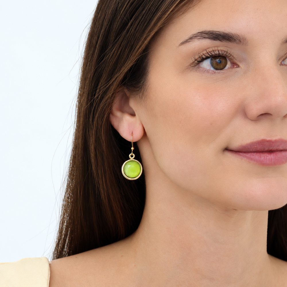 Apple Green Cabochon Dangle Earrings worn on model showing round glass drops
