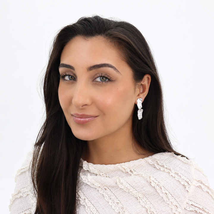 Silver Cobblestone Drop Clip-On Earring worn on brunette model with white lace blouse
