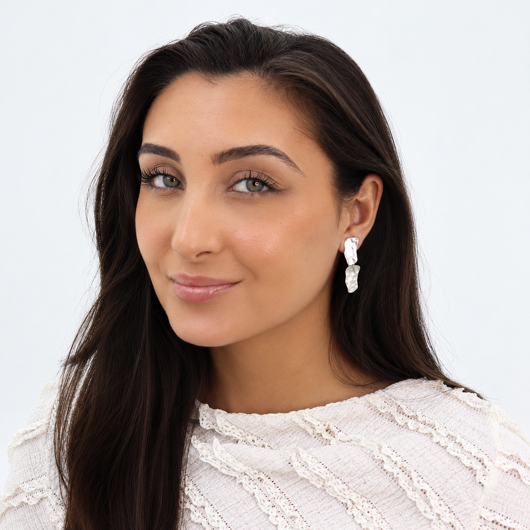 Silver Cobblestone Drop Earrings worn on brunette model showing sculpted dangling metal links