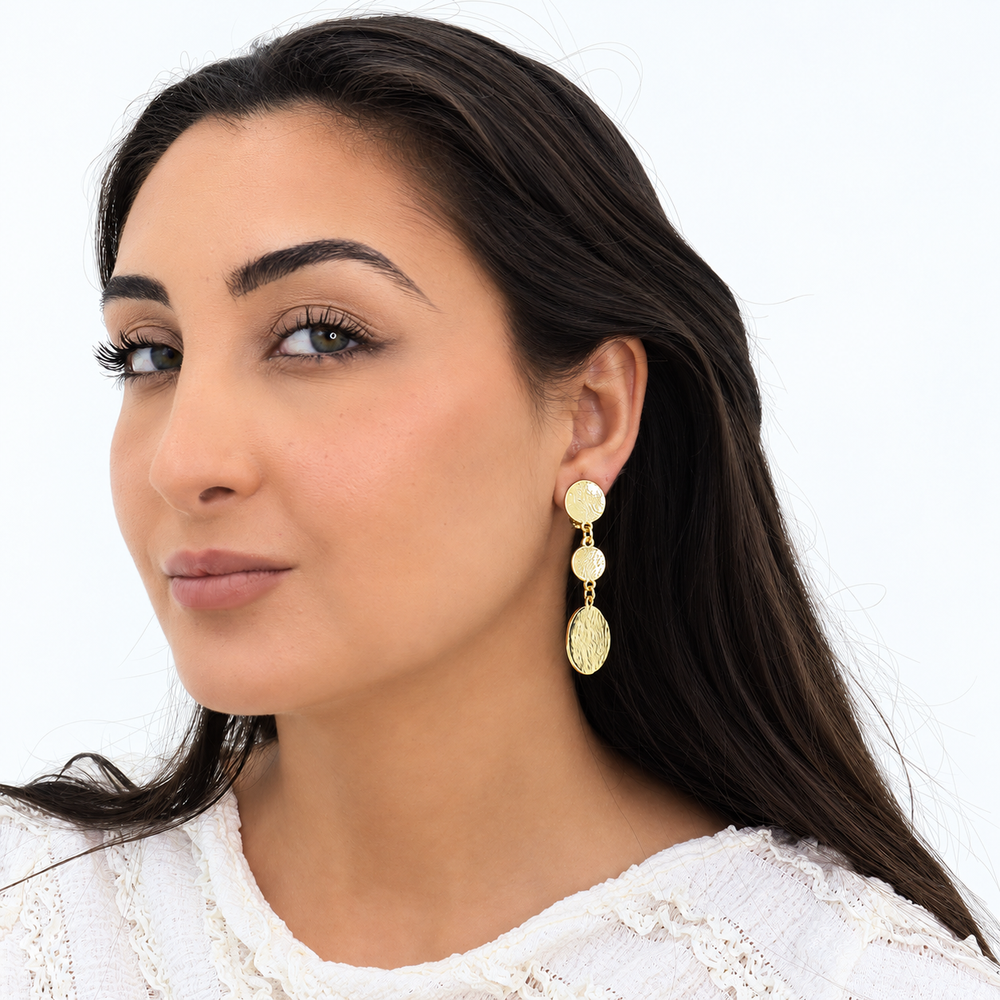 Gold Coin Trio Clip-On Earring worn on brunette model with white textured blouse