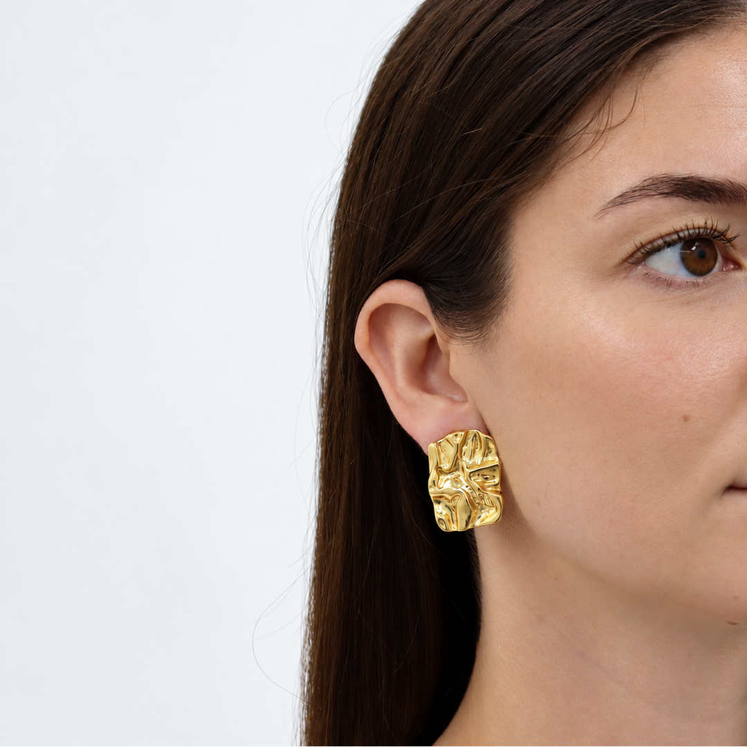 Crumpled Foil Clip-On Earrings worn on brunette model showing sculpted rectangular folds