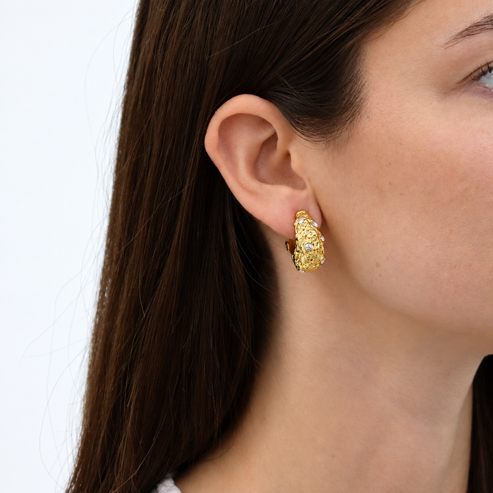Crystal Nest Clip-On Earring worn on brunette model showing woven texture and sparkling stones