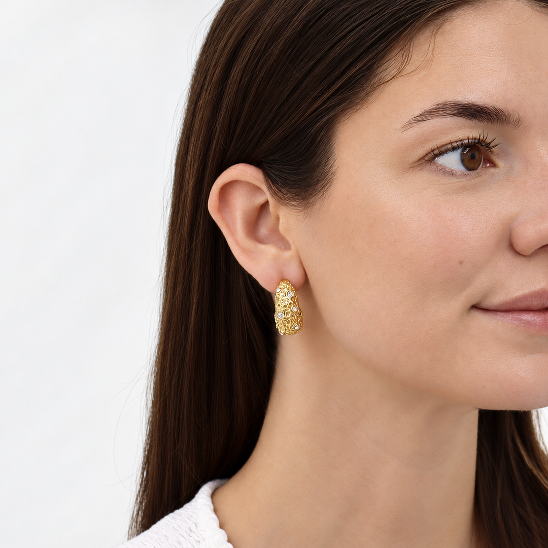 Crystal Nest Hoop Earring worn on brunette model showing textured gold and sparkling stones