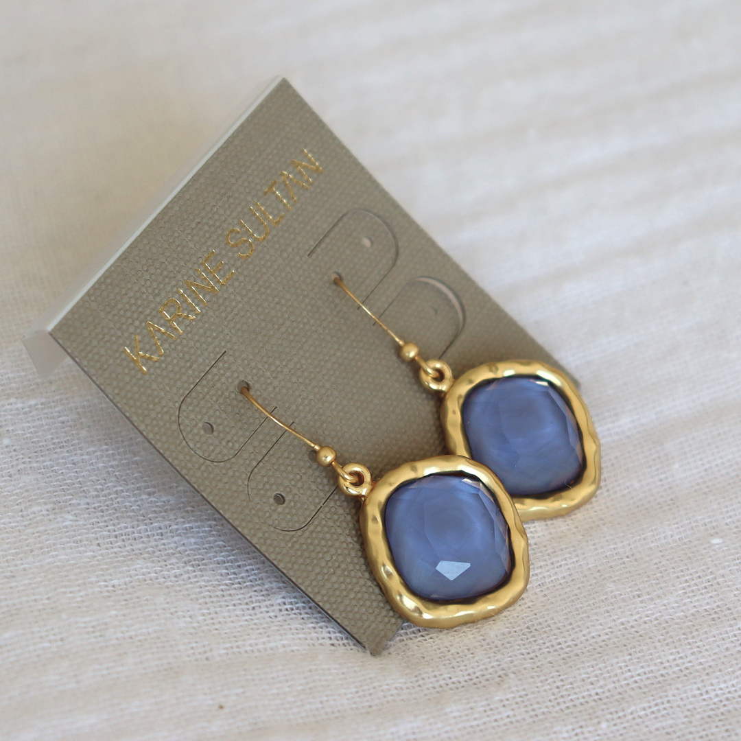 Soft Denim Blue Cushion Bezel Drop Earrings displayed on Karine Sultan card over fabric