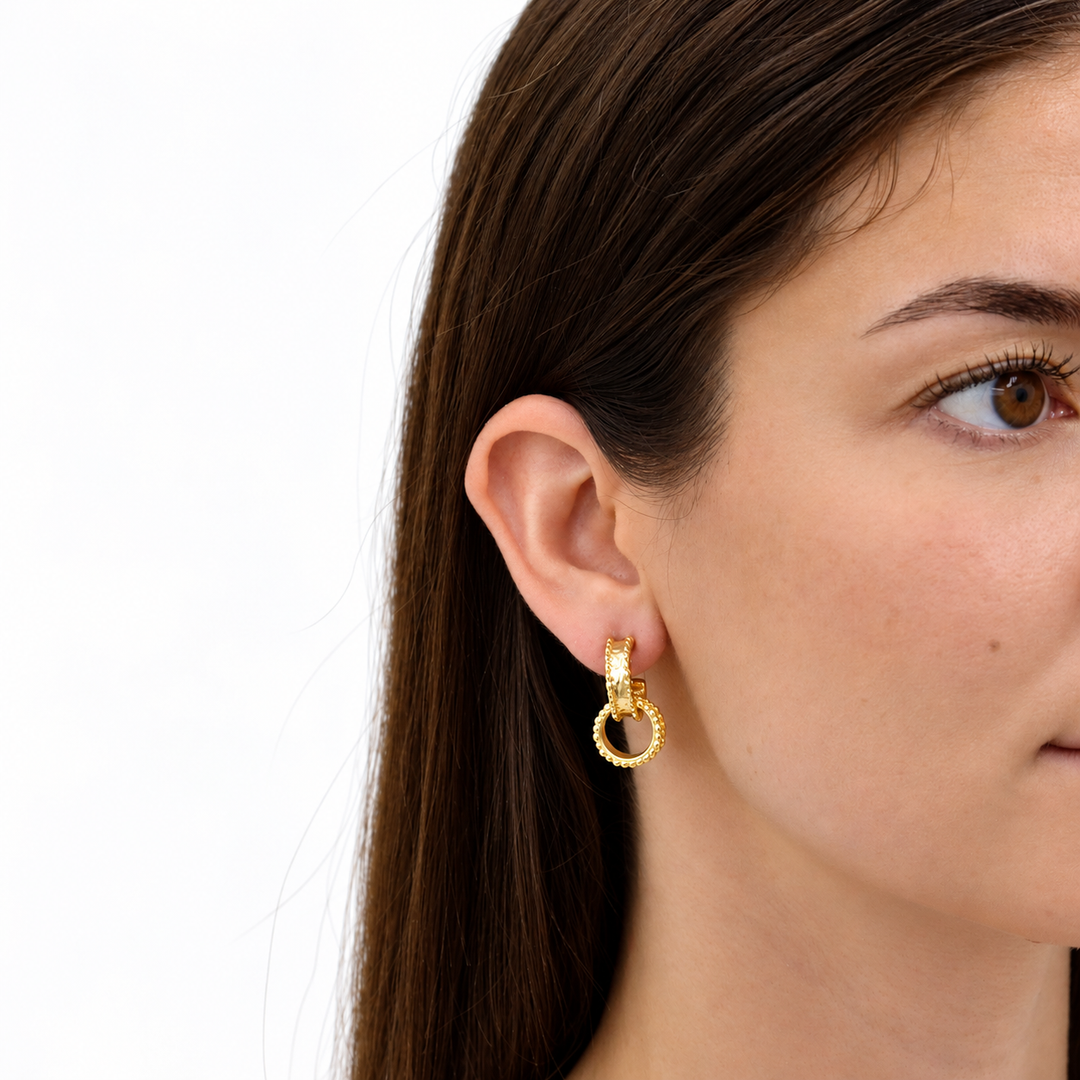 Dotty Intertwined Hoop Earring worn on brunette model with dangling textured circular ring
