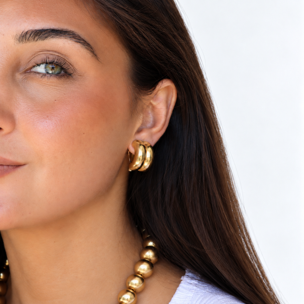 Double Curve Clip-On Earrings worn with coordinating gold plated beaded necklace