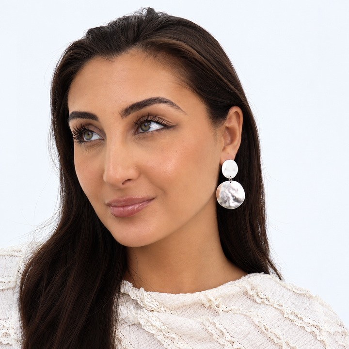 Silver Double Disc Clip-On Earrings worn on brunette model with white lace top