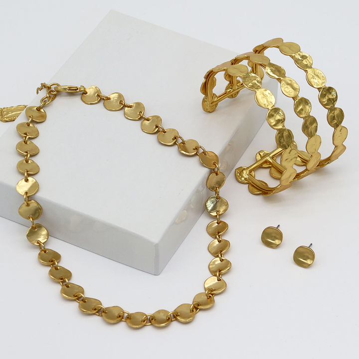 Gold Everyday Stud Earrings styled with matching textured disc necklace and statement cuff