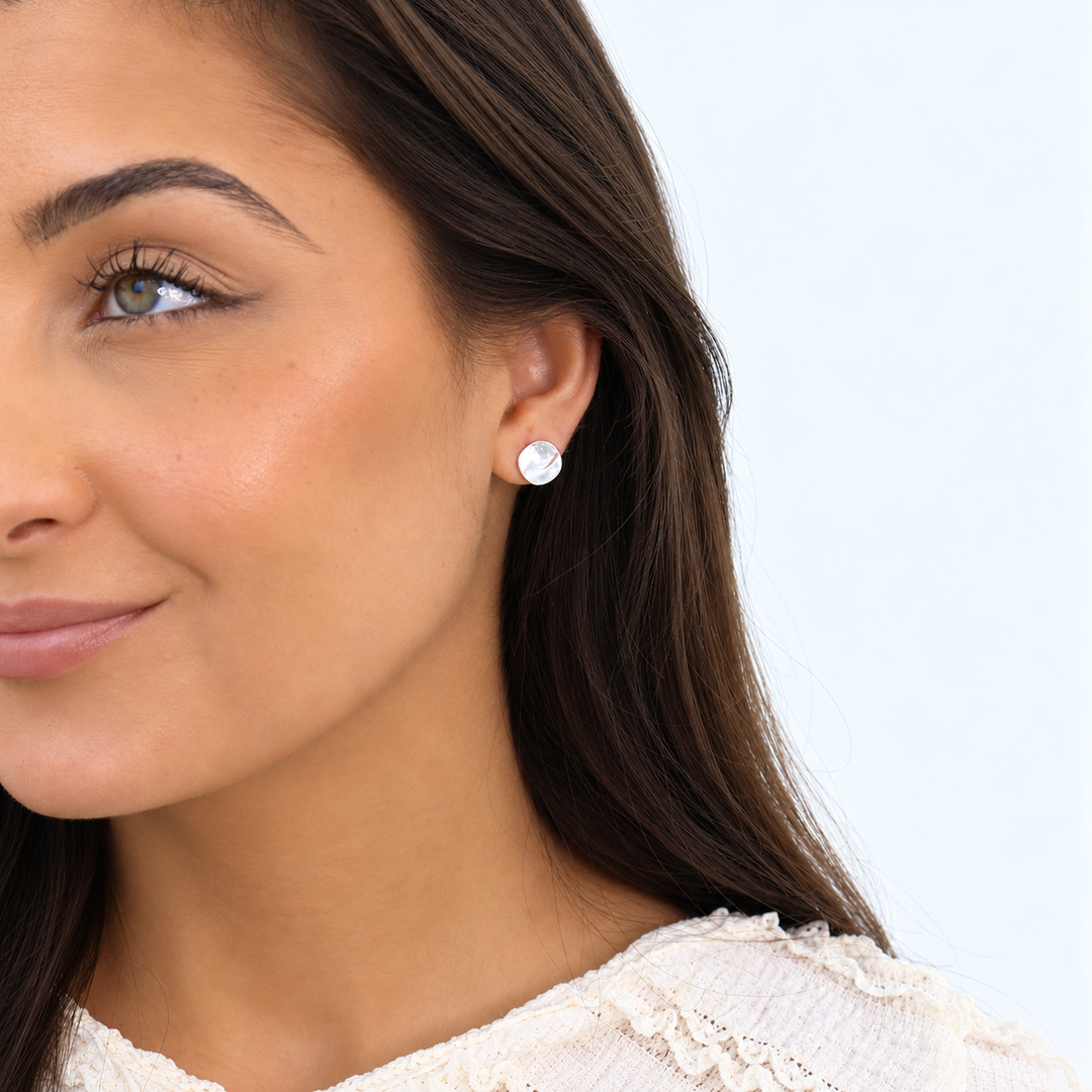 Silver Everyday Stud Earring worn on brunette model showing small textured flat disc