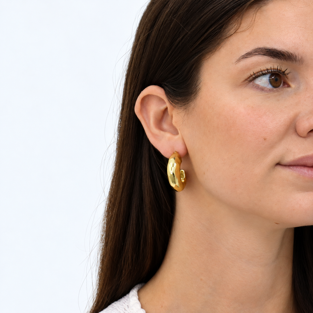 Hammered Metal Hoop Earring worn on brunette model showing rounded shape and subtle texture