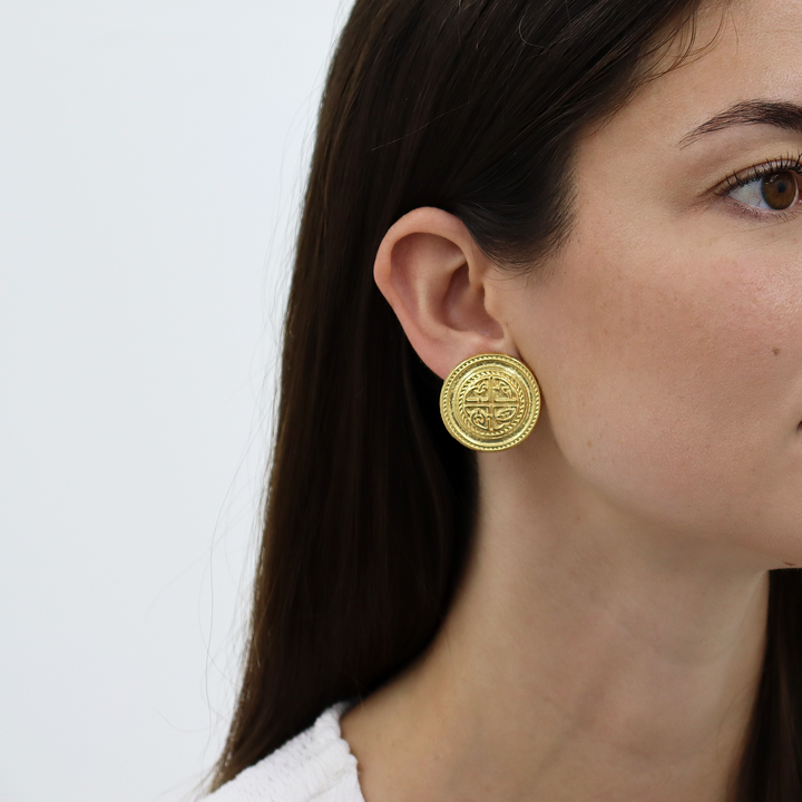 Heritage Medallion Clip-On Earrings worn on model showing round engraved design