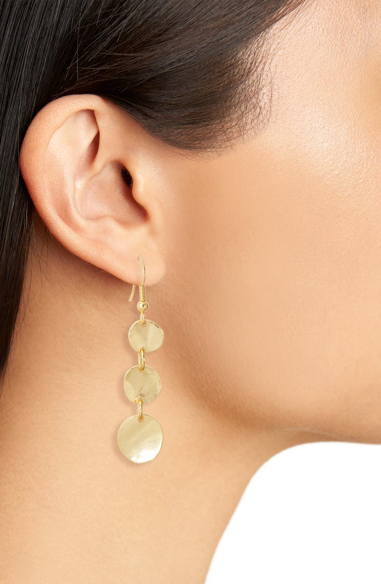 Gold Medallion Discs Drop Earrings worn on model showing three dangling circular discs