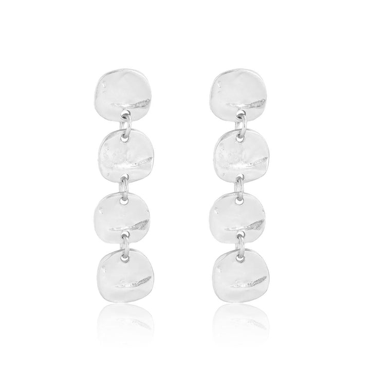 Silver Mini Coin Linear Drop Earrings featuring four softly irregular hammered medallions