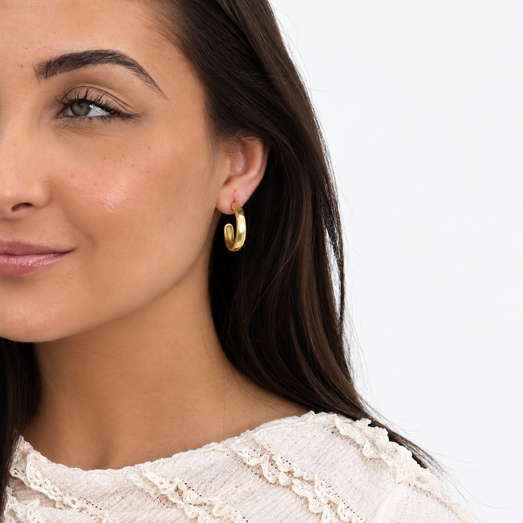 Gold Mini Everyday Hoop Earring worn on brunette model with white textured blouse