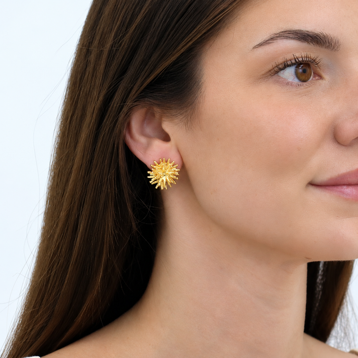 Mini Starburst Stud Earring worn on brunette model showing sculpted radiating design