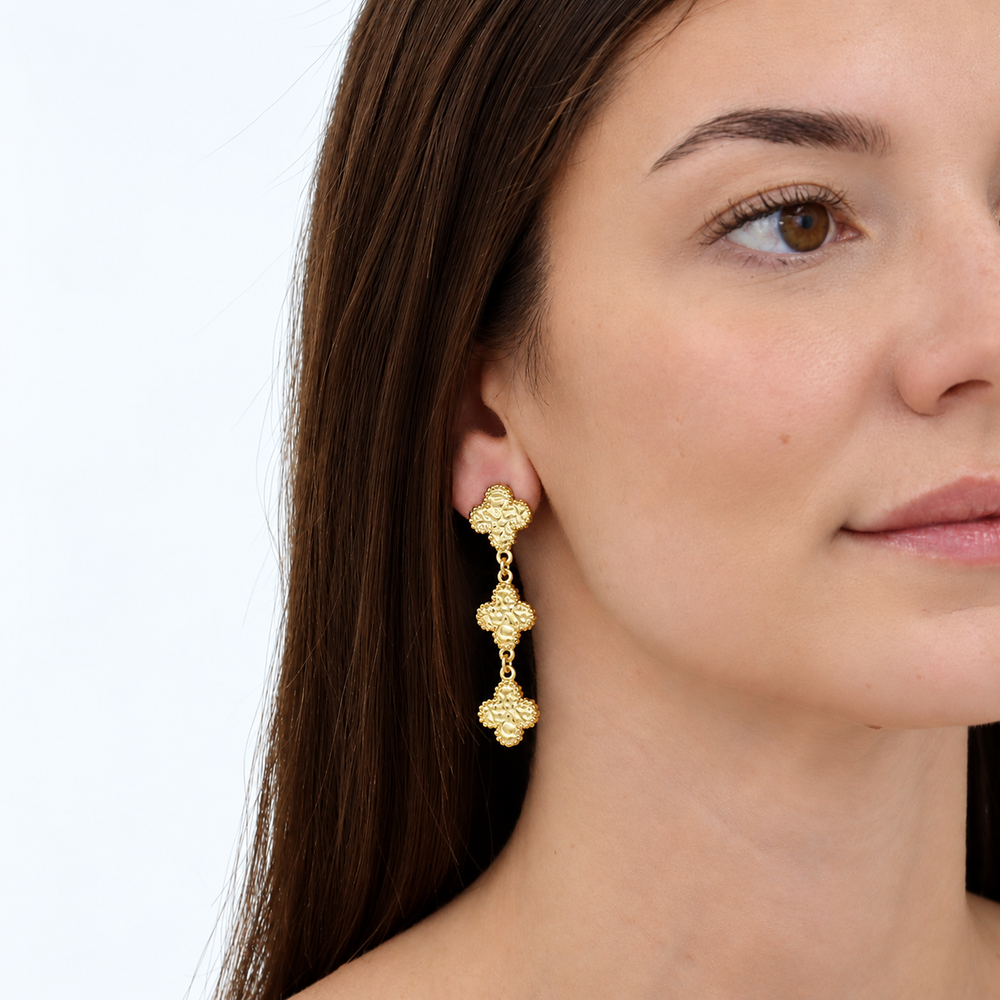 Molten Clovers Drop Earrings worn showing elongated three-clover design