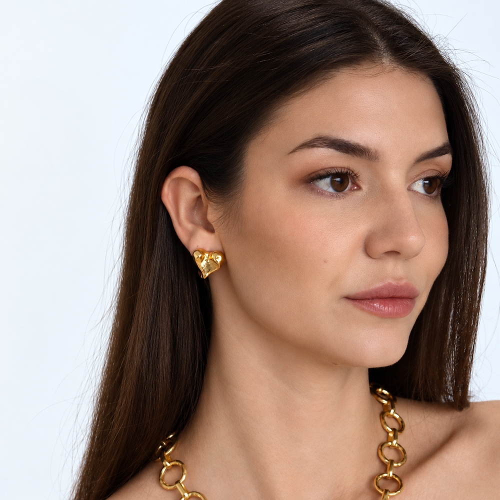 Molten Heart Clip-On Earrings worn on brunette model with gold plated link necklace