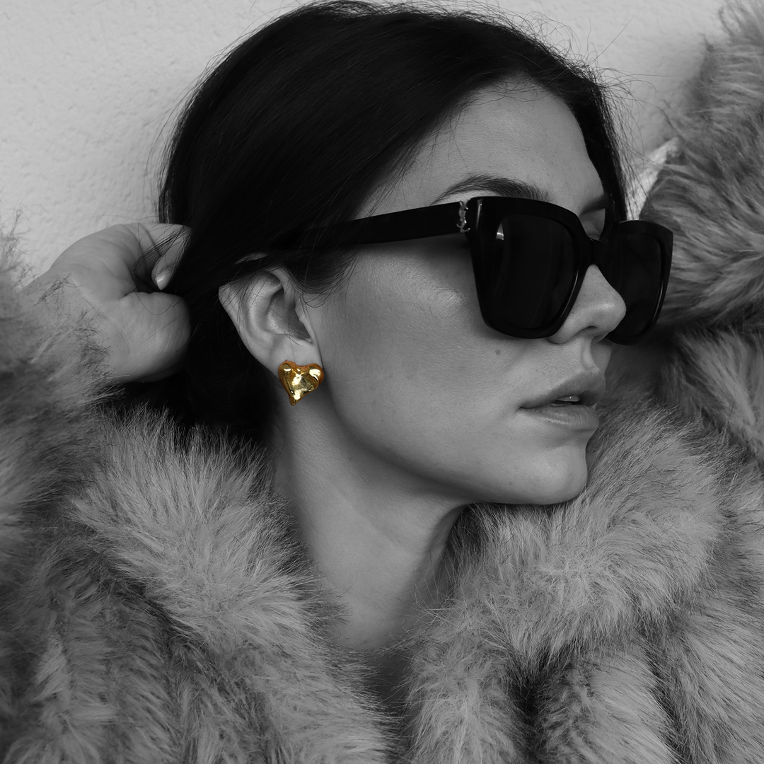 Molten Heart Stud Earring worn with oversized sunglasses and faux fur coat