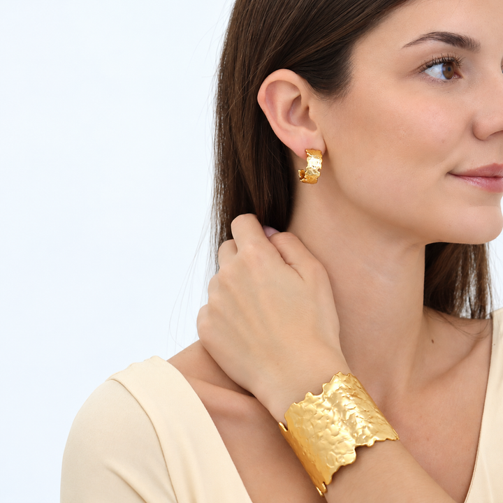 Molten Metal Hoop Earrings worn with matching wide textured gold plated cuff bracelet