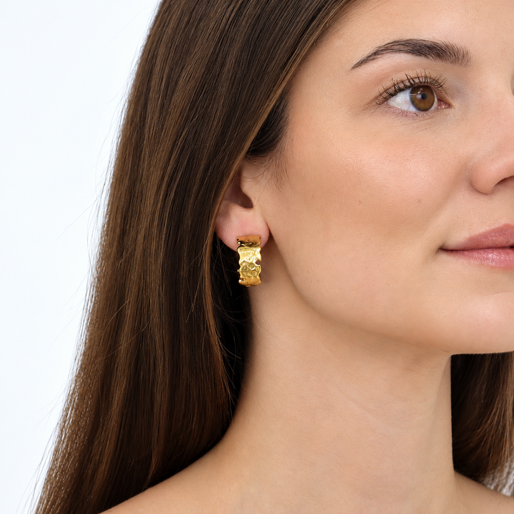 Molten Metal Hoop Earrings worn close up showing irregular gold plated texture