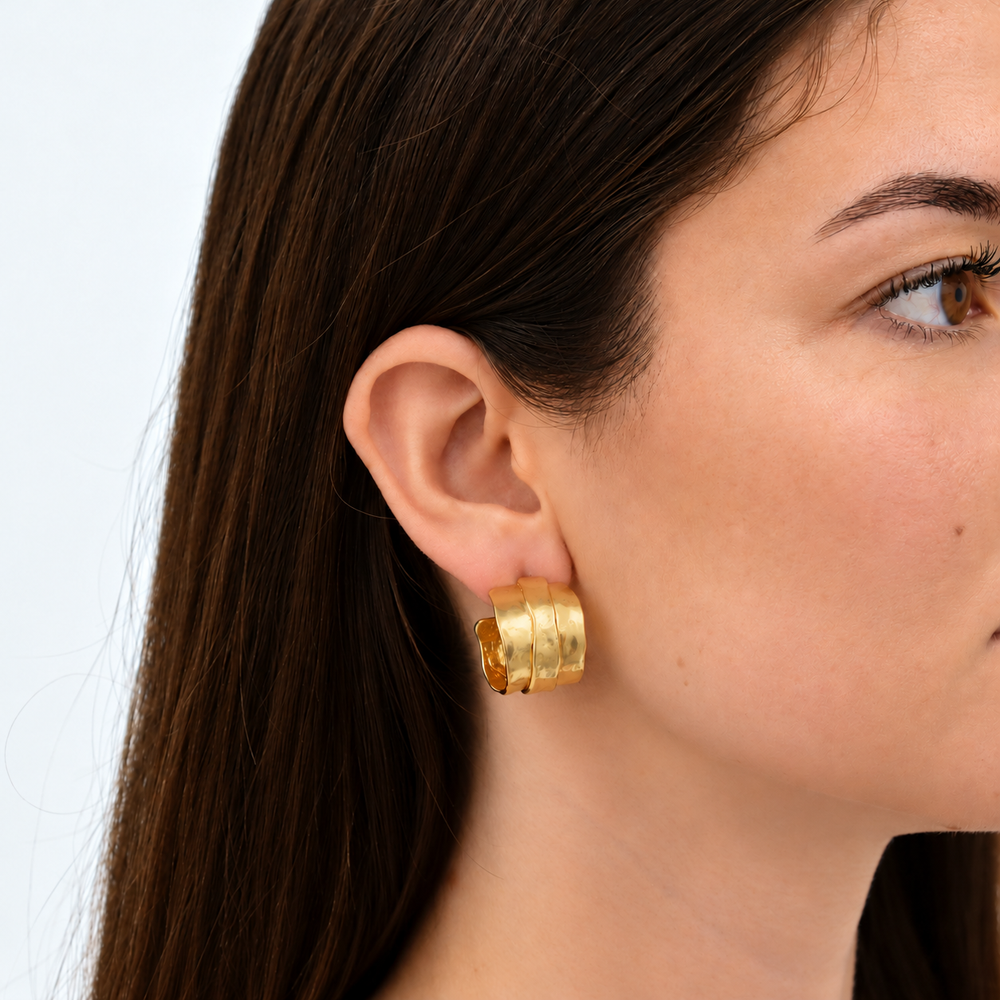 Parchment Texture Hoop Earrings worn on brunette model showing wide layered gold plated design