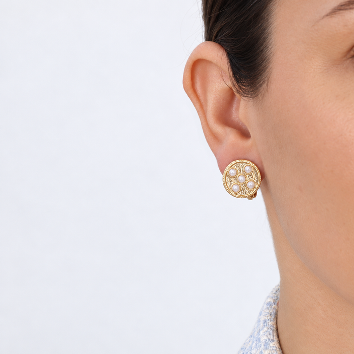 Pearly Coin Clip-On Earring worn close up showing round design with five creamy pearls
