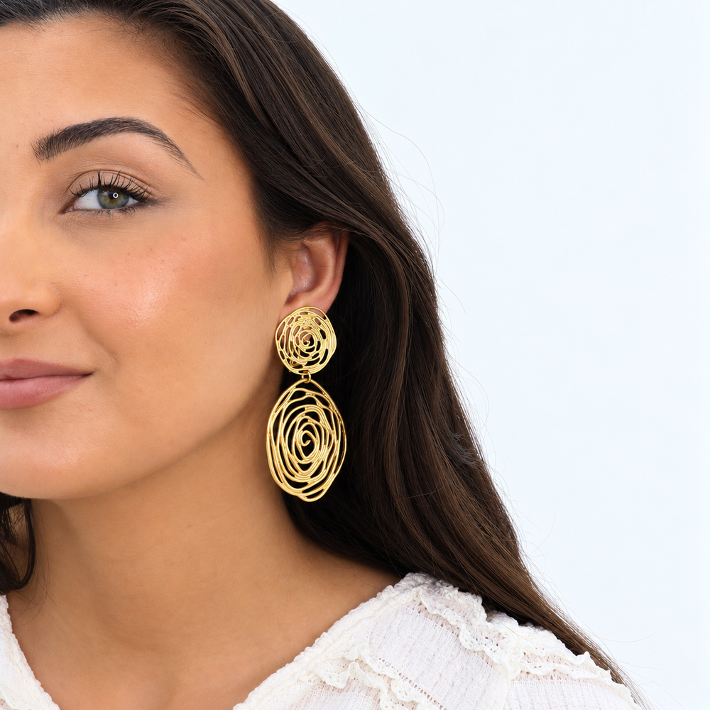 Gold Rose Cut Out Clip-On Earring worn on brunette model with white textured blouse