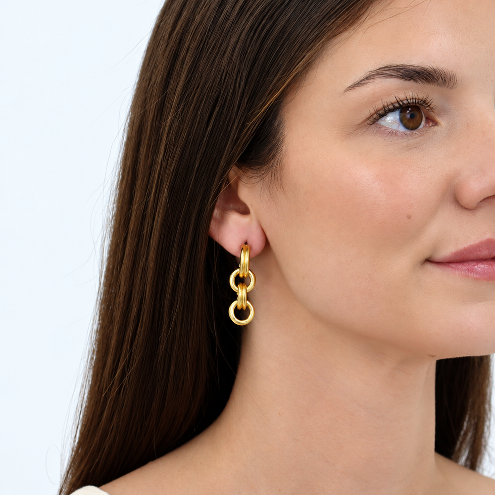 Rounded Chain Drop Earring worn on brunette model showing polished interlocking gold links