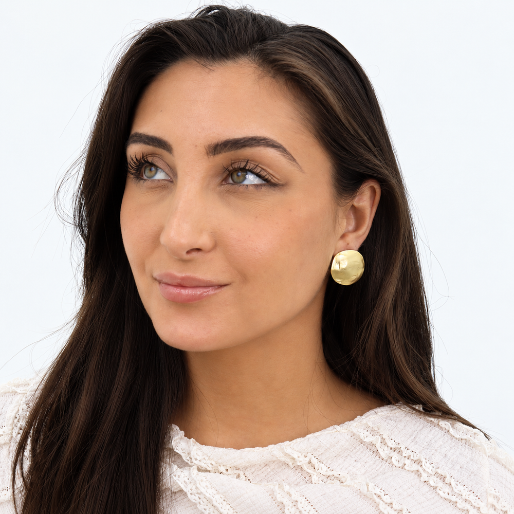 Gold Shell Disc Clip-On Earring worn on brunette model with white lace top