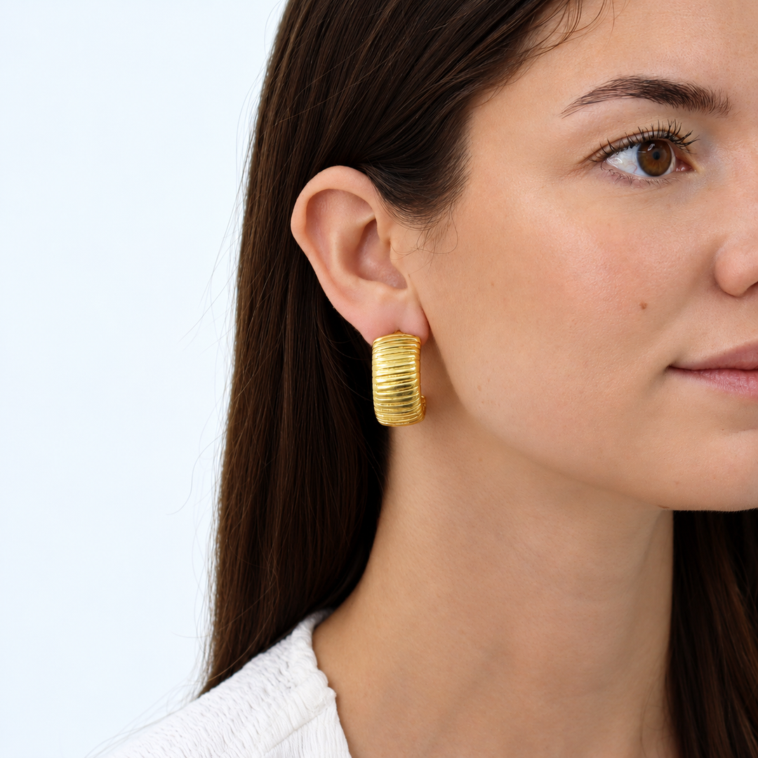 Snake Chain Hoop Earring worn on brunette model showing chunky ribbed gold plated design