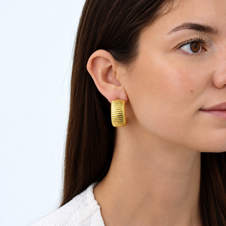 Snake Chain Hoop Earring worn on brunette model showing chunky ribbed gold plated design