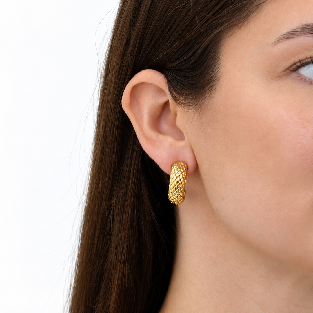 Snake Texture Hoop Earrings worn on model showing curved shape and raised scale detailing