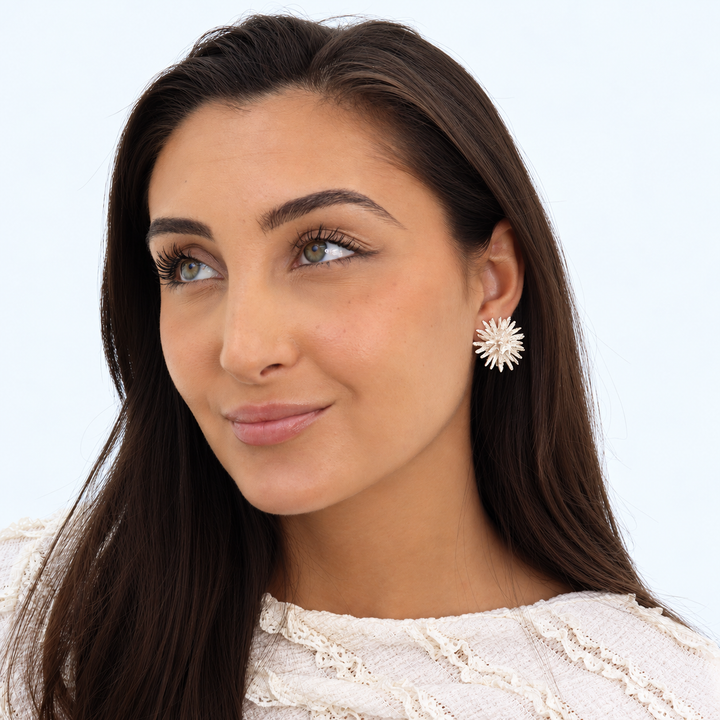 Silver Starburst Clip-On Earring worn on brunette model with white lace blouse