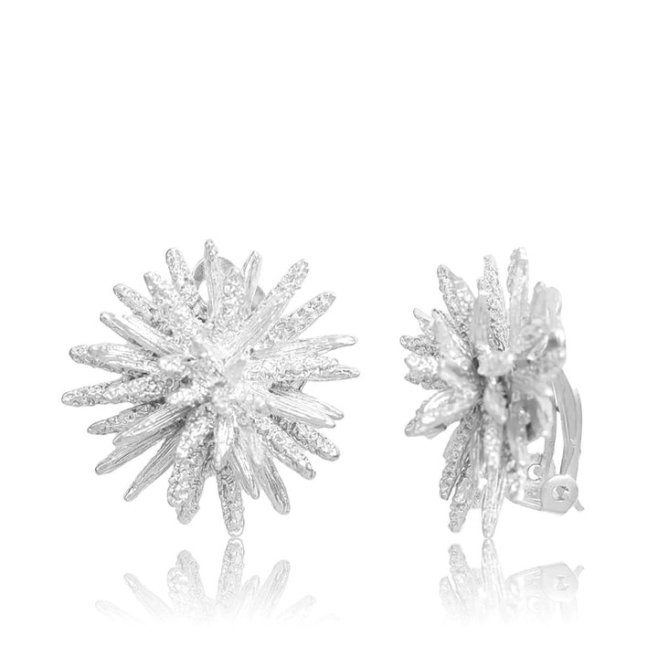 Silver Starburst Clip-On Earrings with dimensional radiating rays and visible clip-on closures