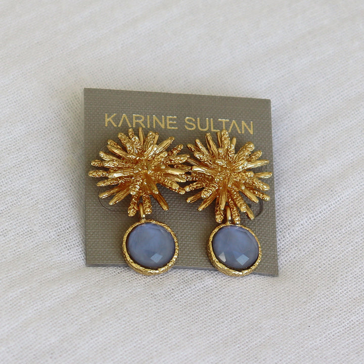 Soft Denim Blue Starburst Gem Drop Earrings displayed on card