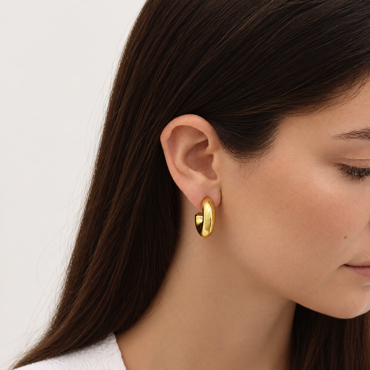 Thick Cylinder Mini Hoop Earrings worn close up showing petite chunky silhouette