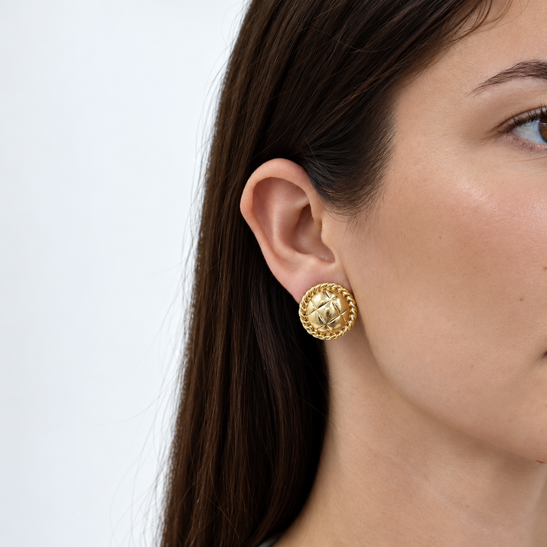 Tufted Texture Clip-On Earring worn on brunette model showing domed quilted design