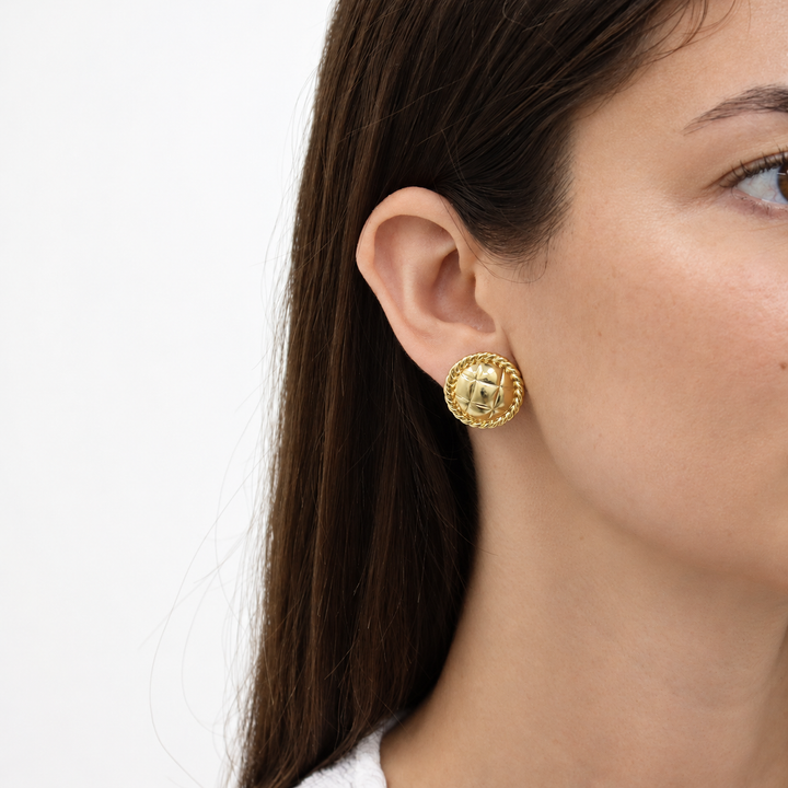 Tufted Texture Stud Earring worn on model showing rounded quilted center and rope border