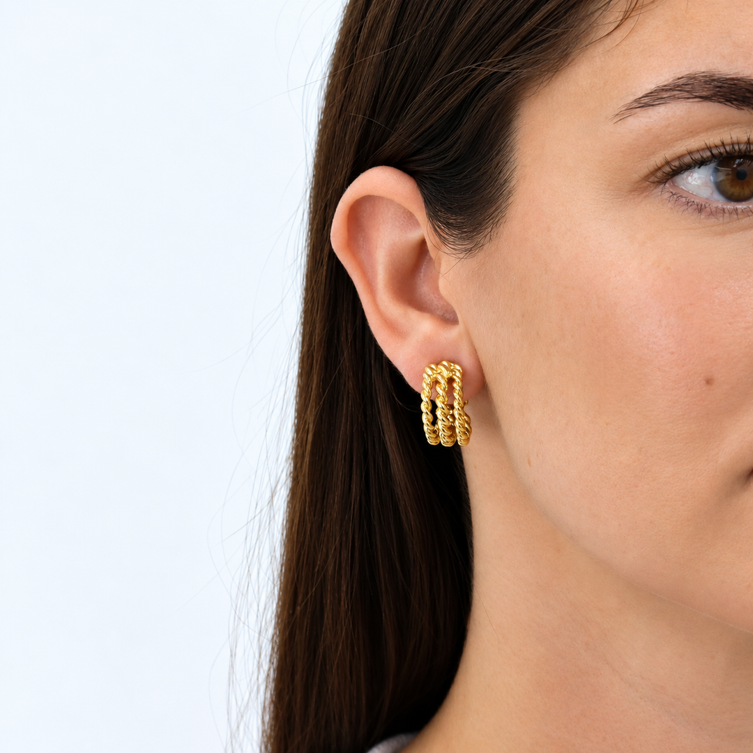 Twisted Rope Clip-On Hoop Earrings worn on brunette model showing layered rope texture
