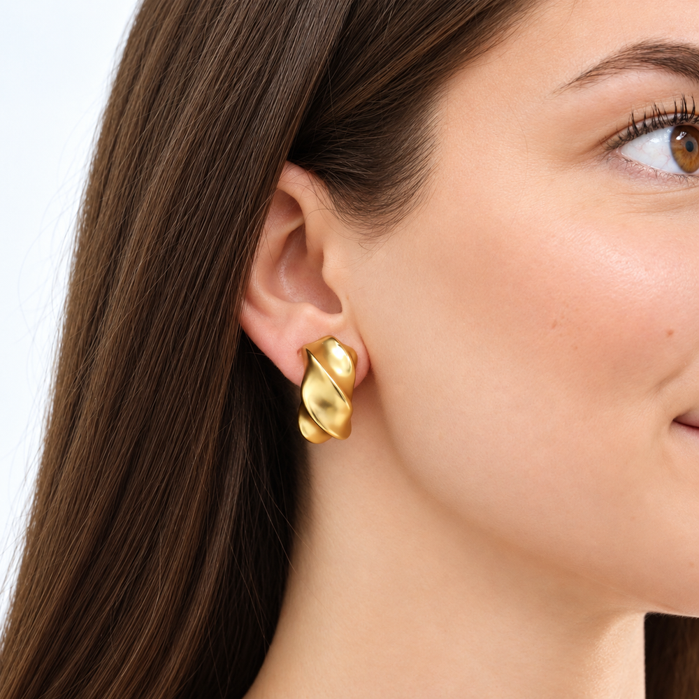 Twisted Wave Clip-On Earrings worn close up showing smooth curved design