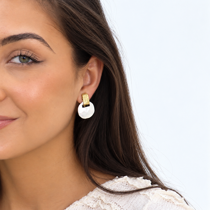 Two Tone Short Drop Clip-On Earring worn on brunette model showing gold and silver contrast