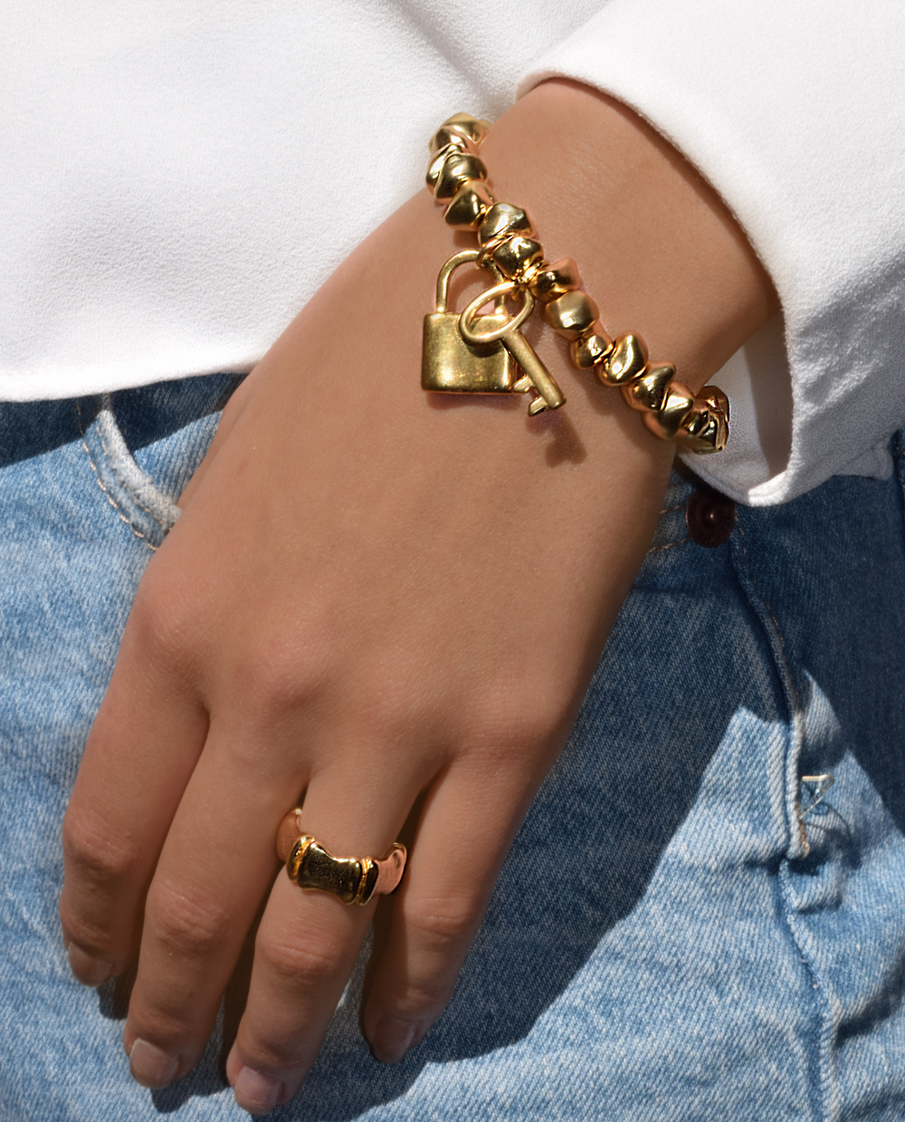 Tumbled rocks bracelet with lock and key charm - Karine Sultan